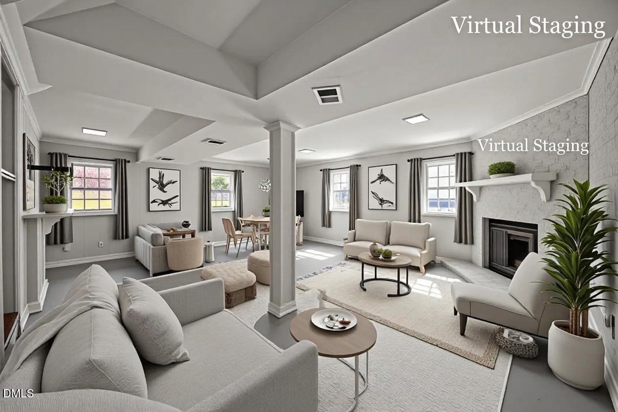3521 Huntleigh Drive Raleigh, NC 27604 - Photo 27 of 56 a living room with furniture potted plant and a fireplace