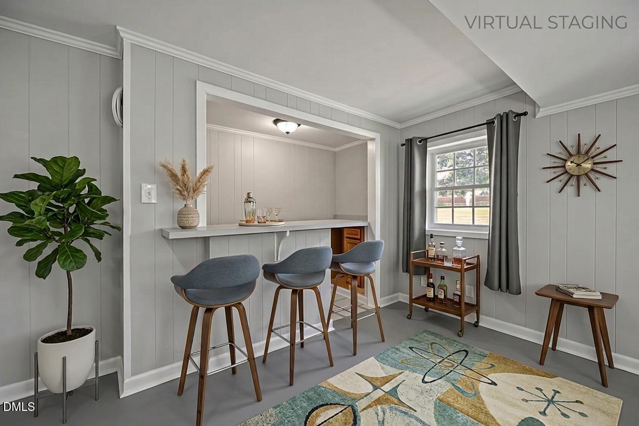 3521 Huntleigh Drive Raleigh, NC 27604 - Photo 31 of 56 a living room with furniture and a potted plant
