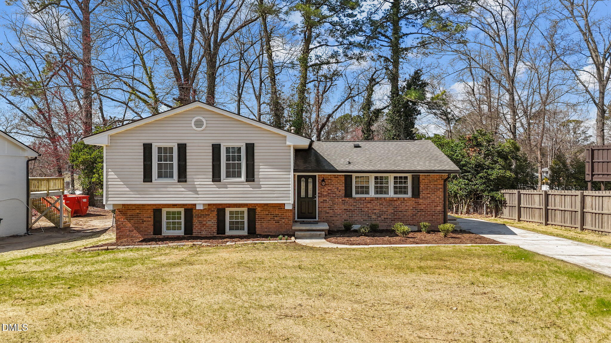3521 Huntleigh Drive Raleigh, NC 27604 - Photo 36 of 56 a front view of a house with a yard covered with snow and trees