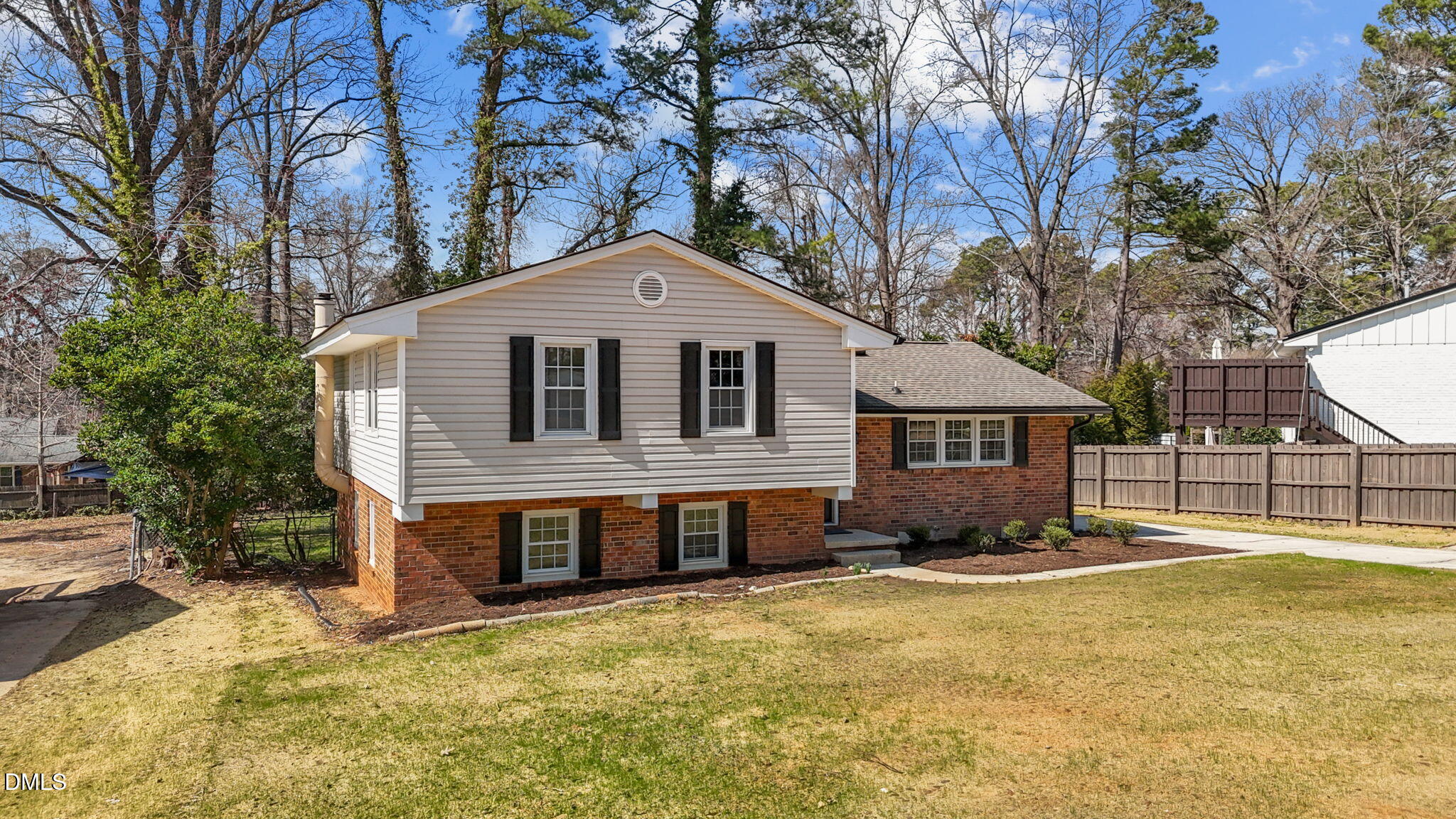 3521 Huntleigh Drive Raleigh, NC 27604 - Photo 37 of 56 a front view of a house with a yard covered with snow in front of house
