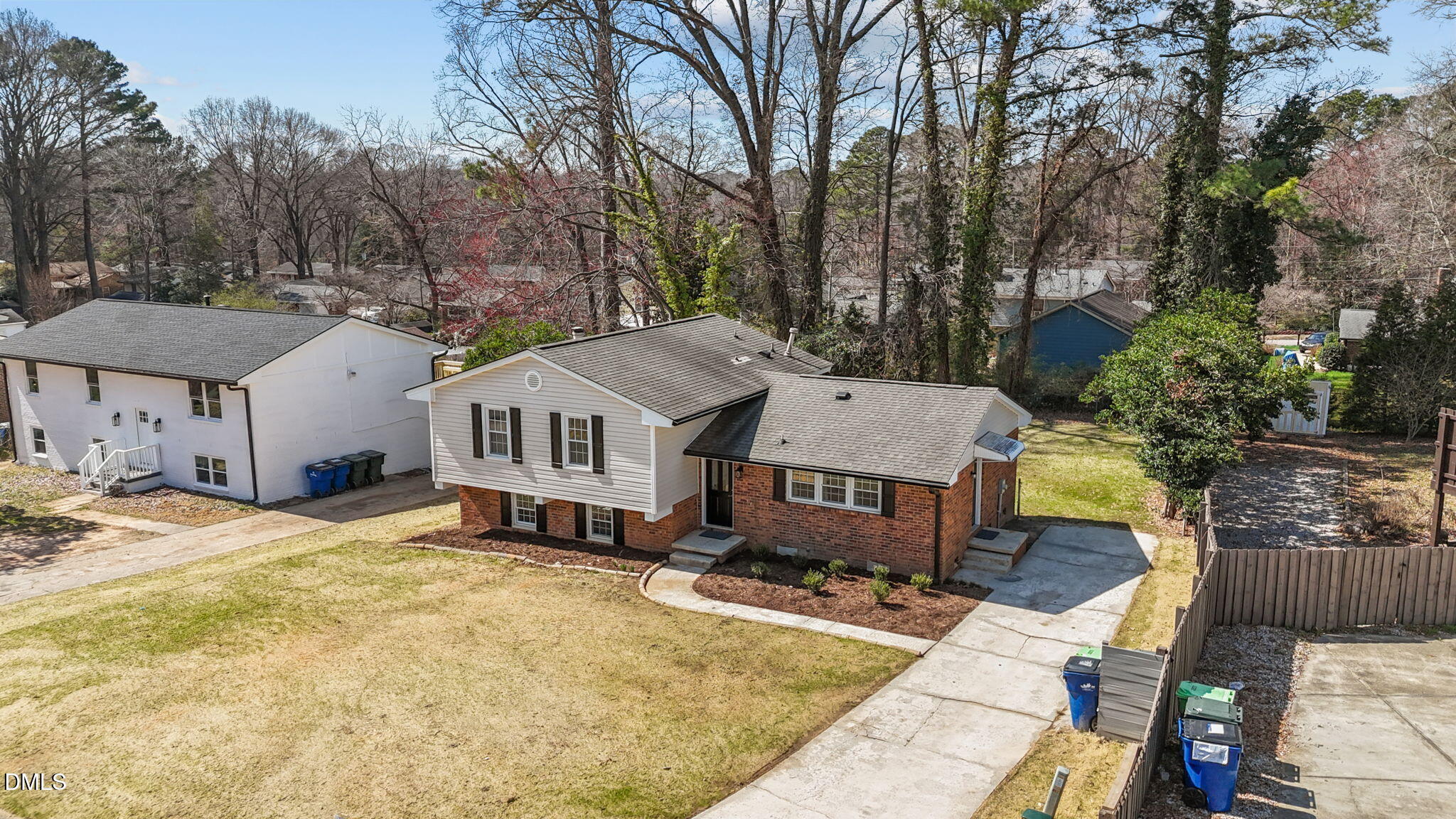 3521 Huntleigh Drive Raleigh, NC 27604 - Photo 38 of 56 a aerial view of a house with table and chairs under an umbrella