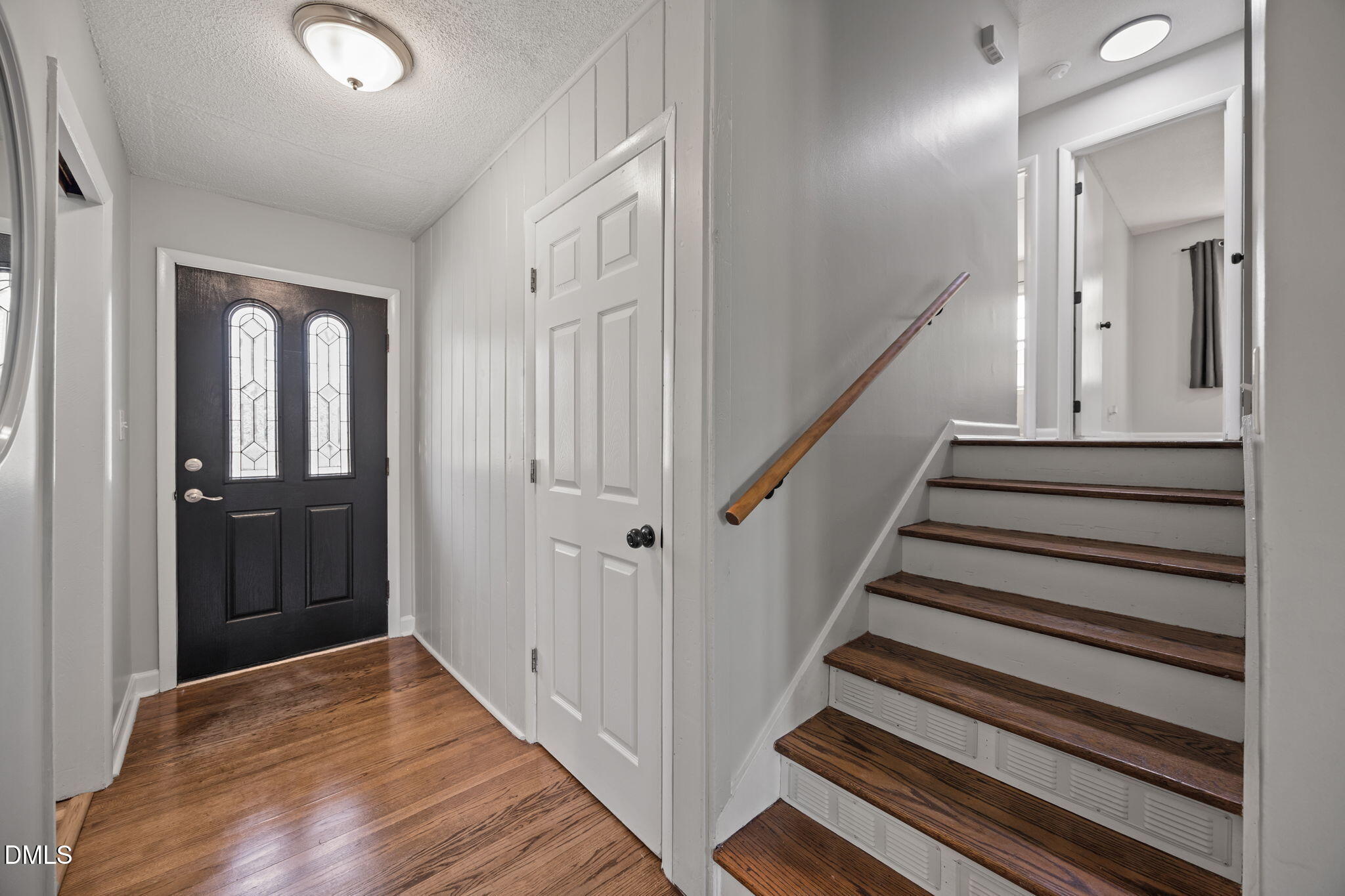 3521 Huntleigh Drive Raleigh, NC 27604 - Photo 3 of 56 a view of a hallway with wooden floor and entryway