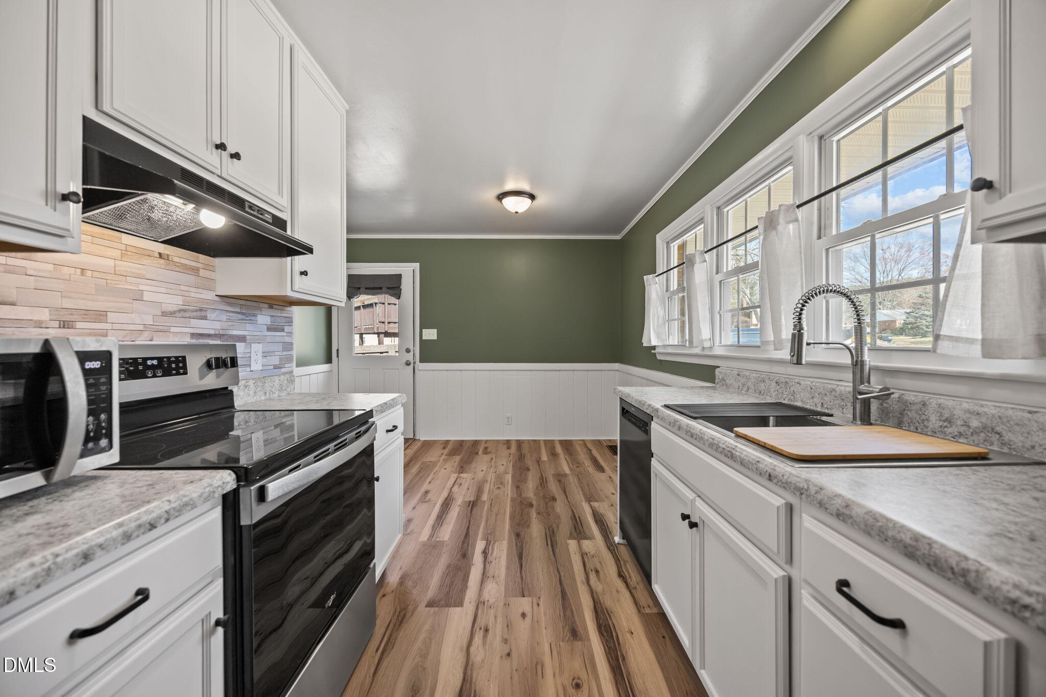 3521 Huntleigh Drive Raleigh, NC 27604 - Photo 4 of 56 a kitchen with granite countertop stainless steel appliances and wooden cabinets