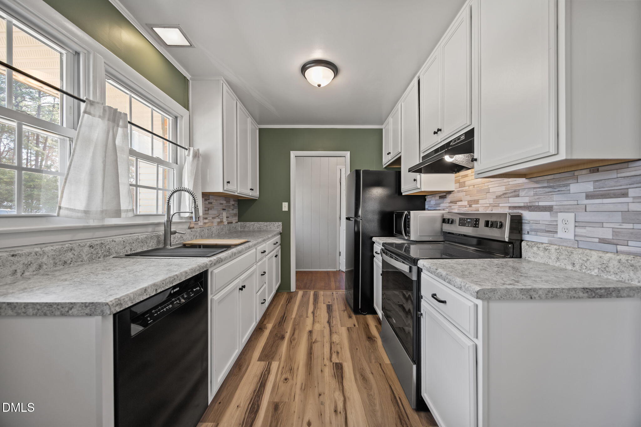 3521 Huntleigh Drive Raleigh, NC 27604 - Photo 5 of 56 a kitchen with a sink stove and refrigerator