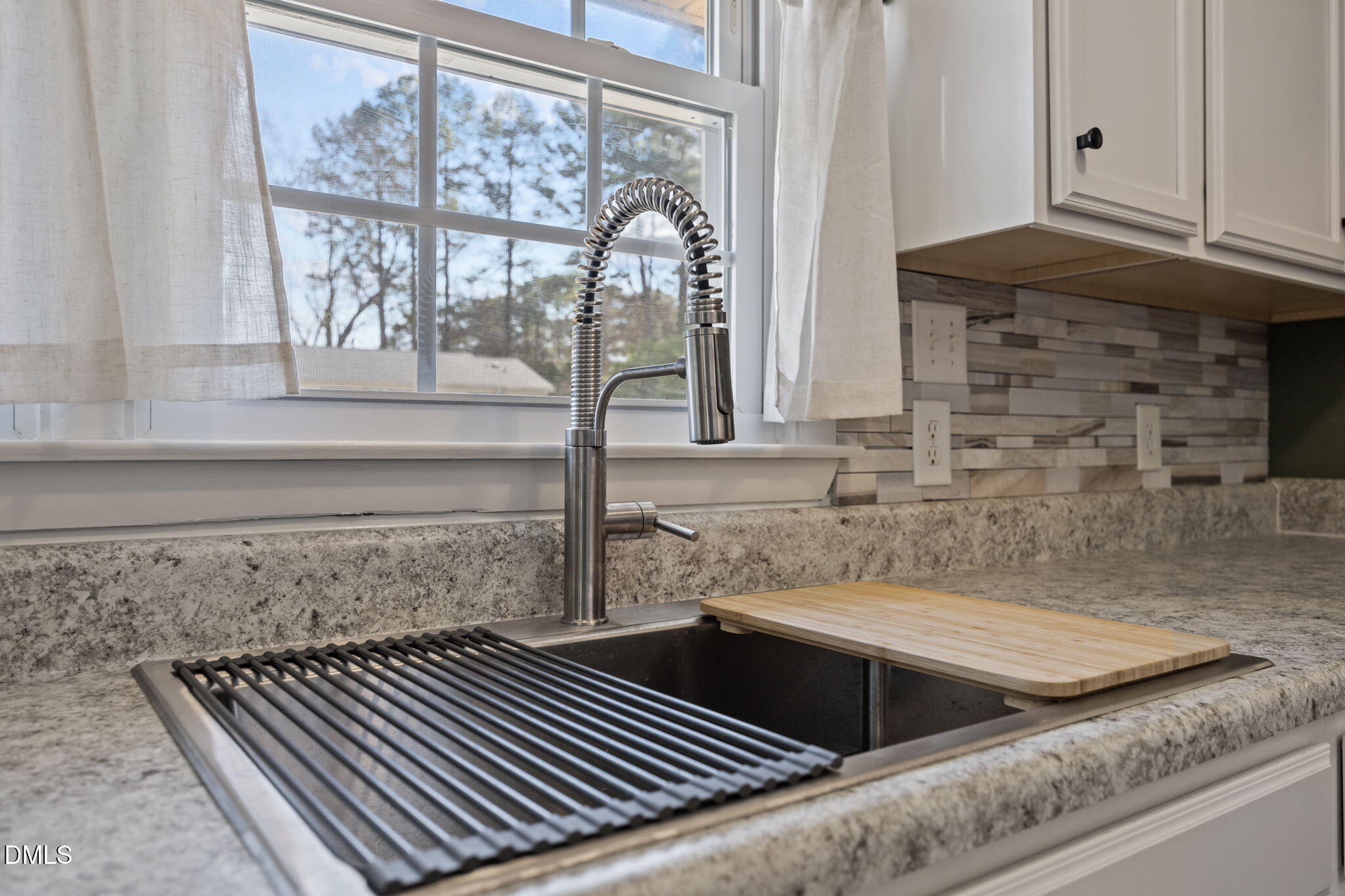 3521 Huntleigh Drive Raleigh, NC 27604 - Photo 6 of 56 a kitchen with a sink and a window