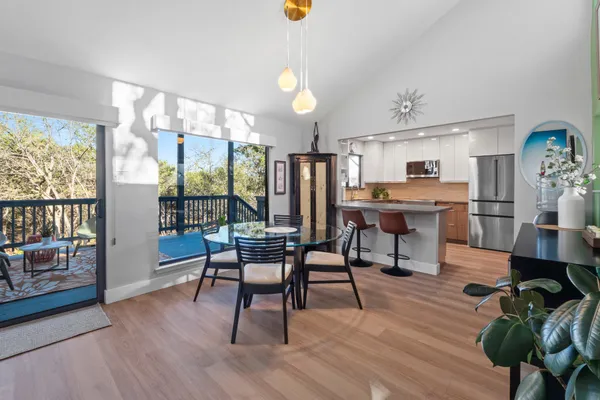a view of a dining room with furniture window and wooden floor