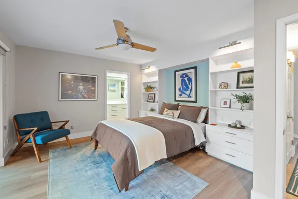 a bed room with a bed and a chair