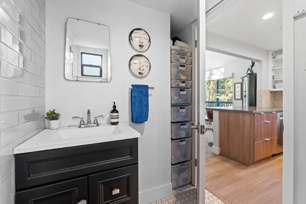 a kitchen with a sink cabinets and a window