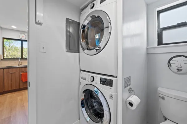 a view of a storage and utility room with washer and dryer