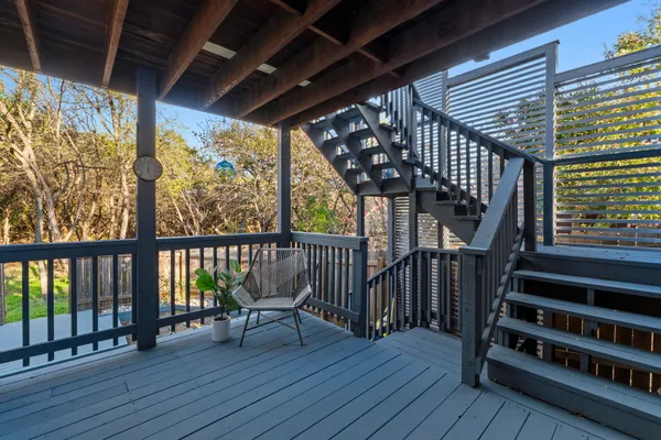a view of a balcony with wooden floor