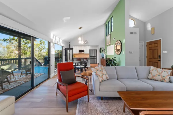 a living room with furniture and a large window