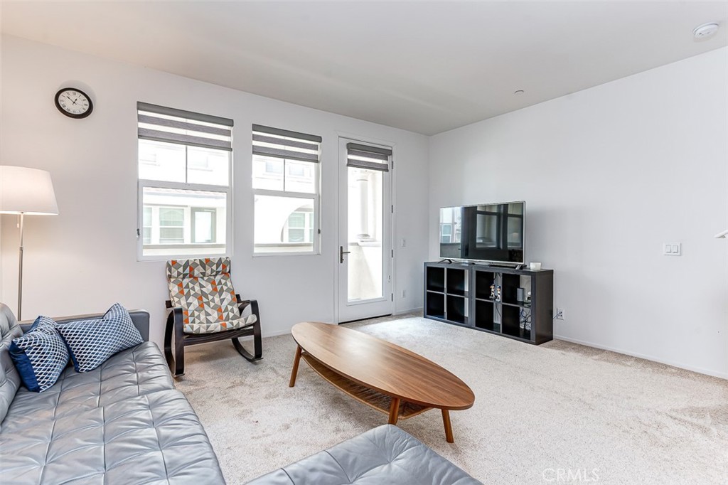 5756 Spring Street Buena Park, CA 90621 - Photo 4 of 16 a living room with furniture and a flat screen tv
