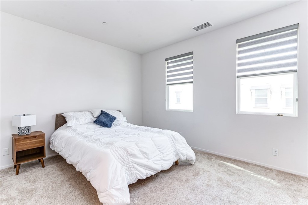 5756 Spring Street Buena Park, CA 90621 - Photo 5 of 16 a bedroom with a bed and window