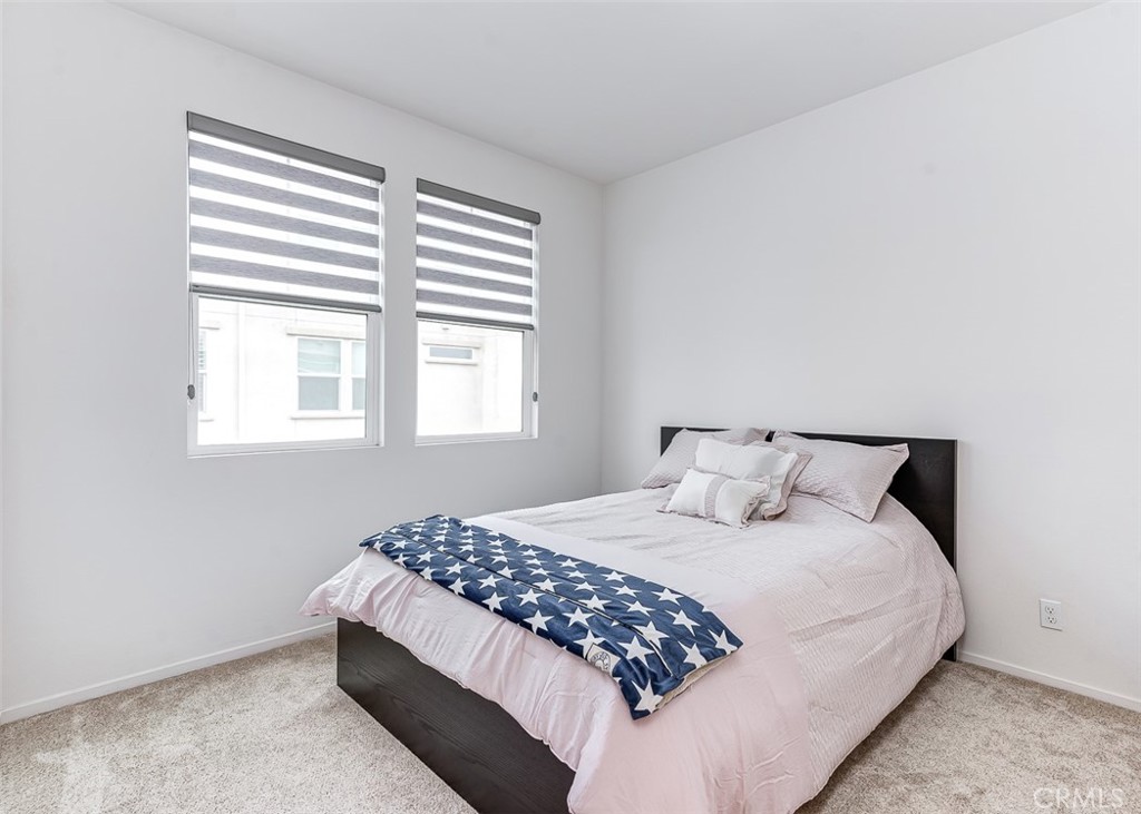 5756 Spring Street Buena Park, CA 90621 - Photo 7 of 16 a bedroom with a large bed and a window