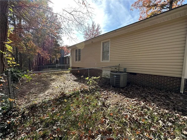 a backyard of a house with lots of green space