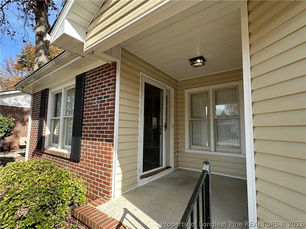 a front view of a house with a glass door