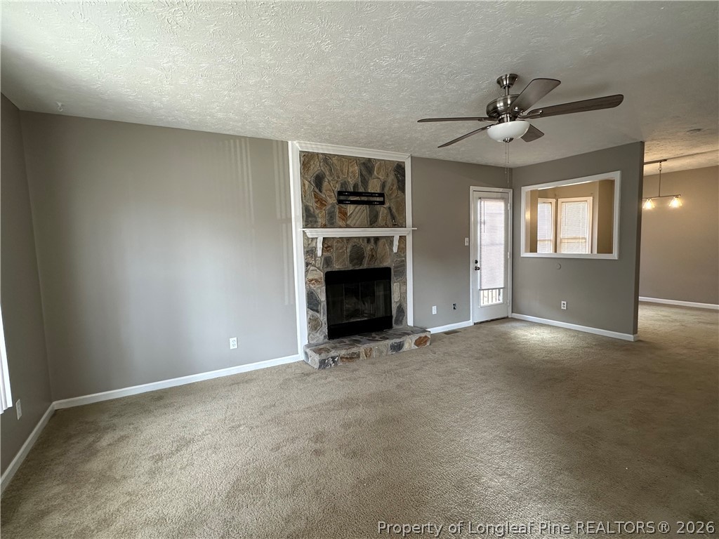 2678 Rivercliff Road Fayetteville, NC 28301 - Photo 3 of 19 a view of an empty room with window and fireplace