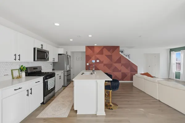 a view of a dining room with furniture and window