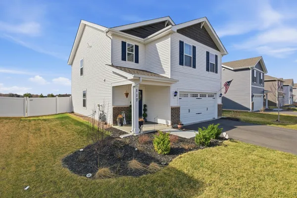a front view of a house with a yard