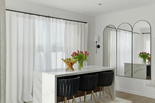 a view of a bedroom with a bed and a window