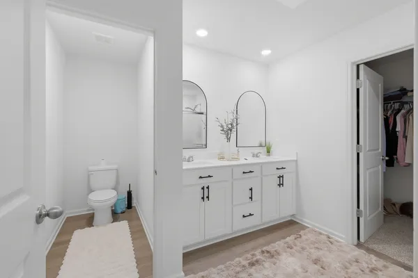 a bathroom with a shower curtain and a window