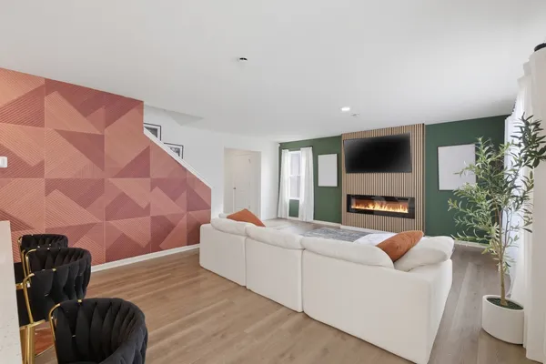 a living room with a couch and a flat screen tv