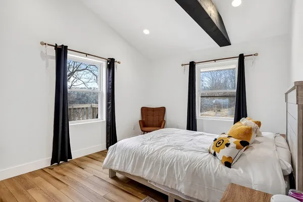 a en suite bathroom with a double vanity sink a mirror and a shower