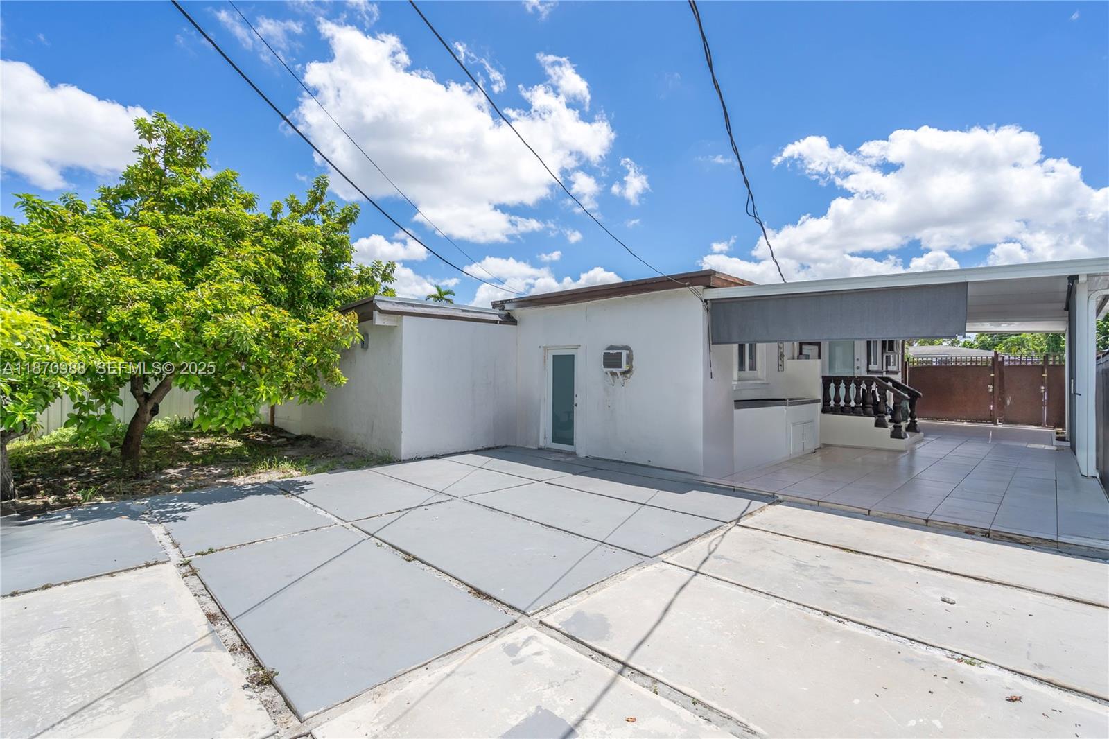 171 West 64th Street Hialeah, FL 33012 - Photo 15 of 22 a view of a house with a patio