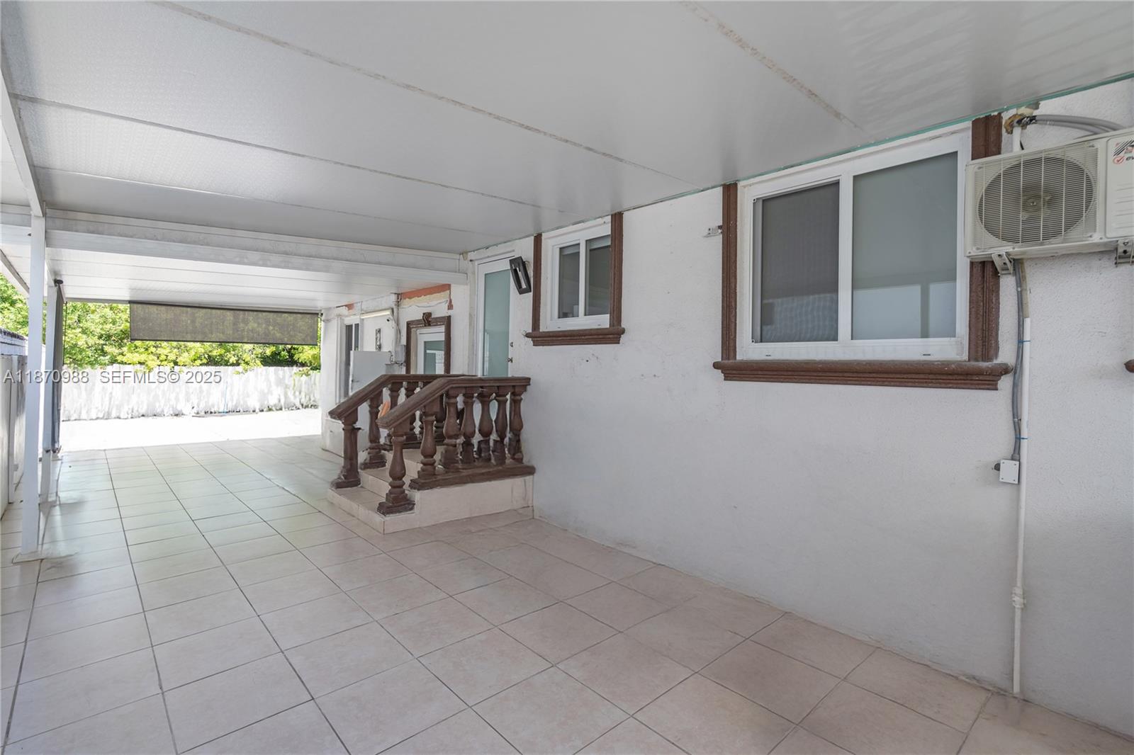 171 West 64th Street Hialeah, FL 33012 - Photo 20 of 22 a living room with furniture and a window