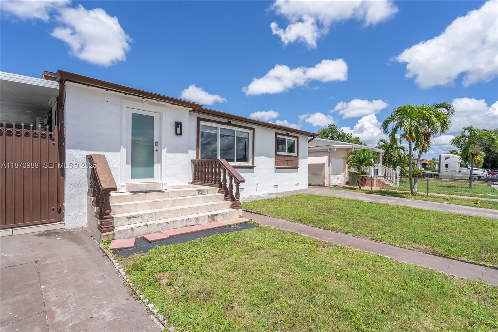 171 West 64th Street Hialeah, FL 33012 - Photo 4 of 22 a front view of a house with a patio