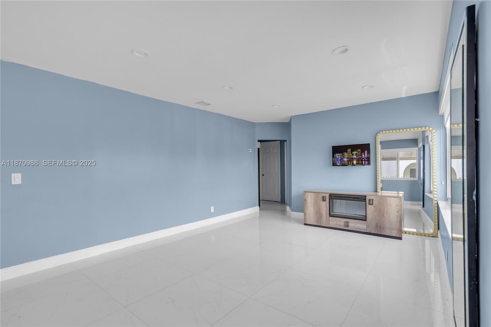 171 West 64th Street Hialeah, FL 33012 - Photo 5 of 22 a view of a livingroom with a fireplace