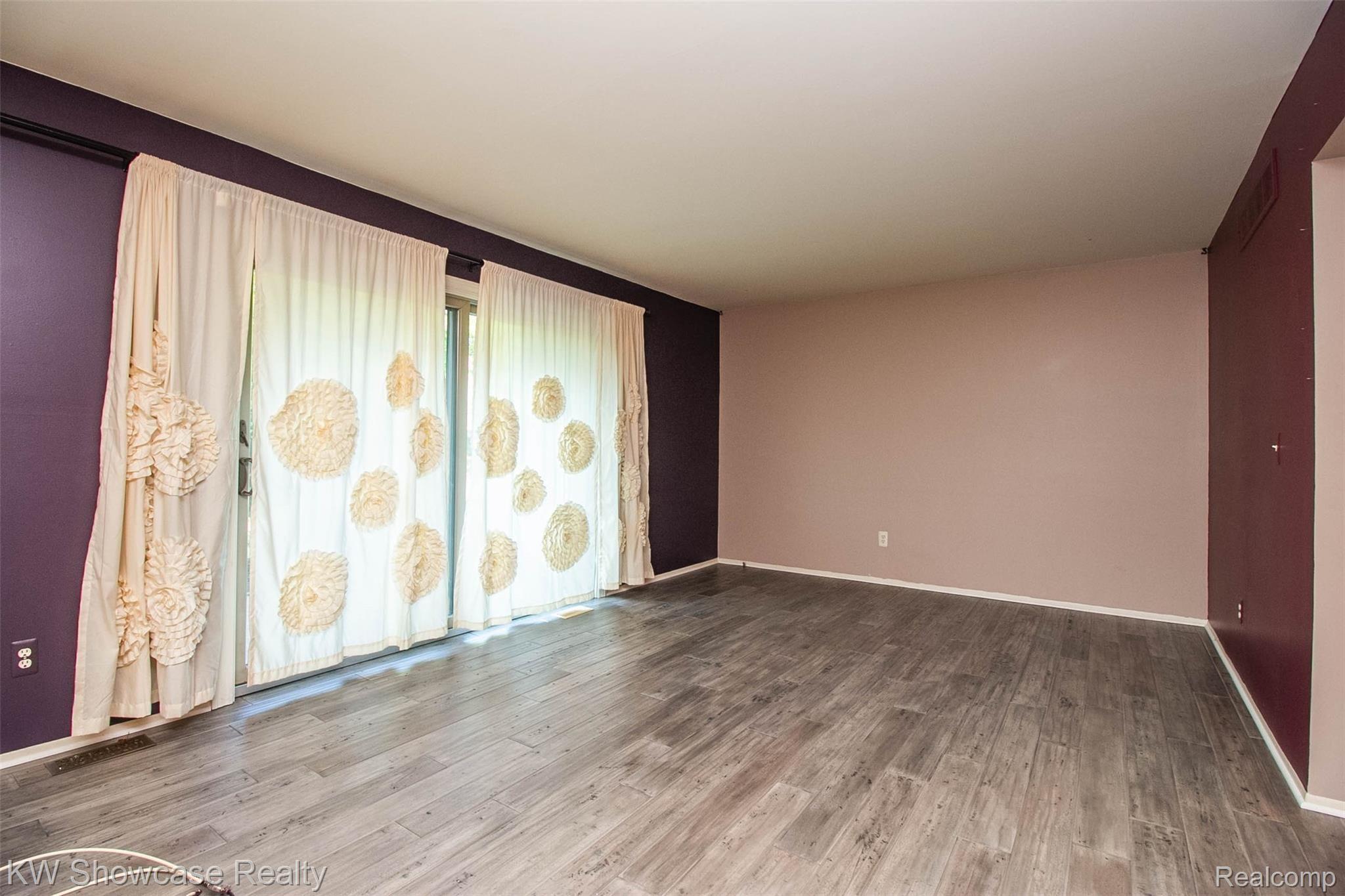 3656 Old Creek Road, Unit 134 Troy, MI 48084 - Photo 16 of 39 Another view from the dining room to the family room with double door walls to private patio