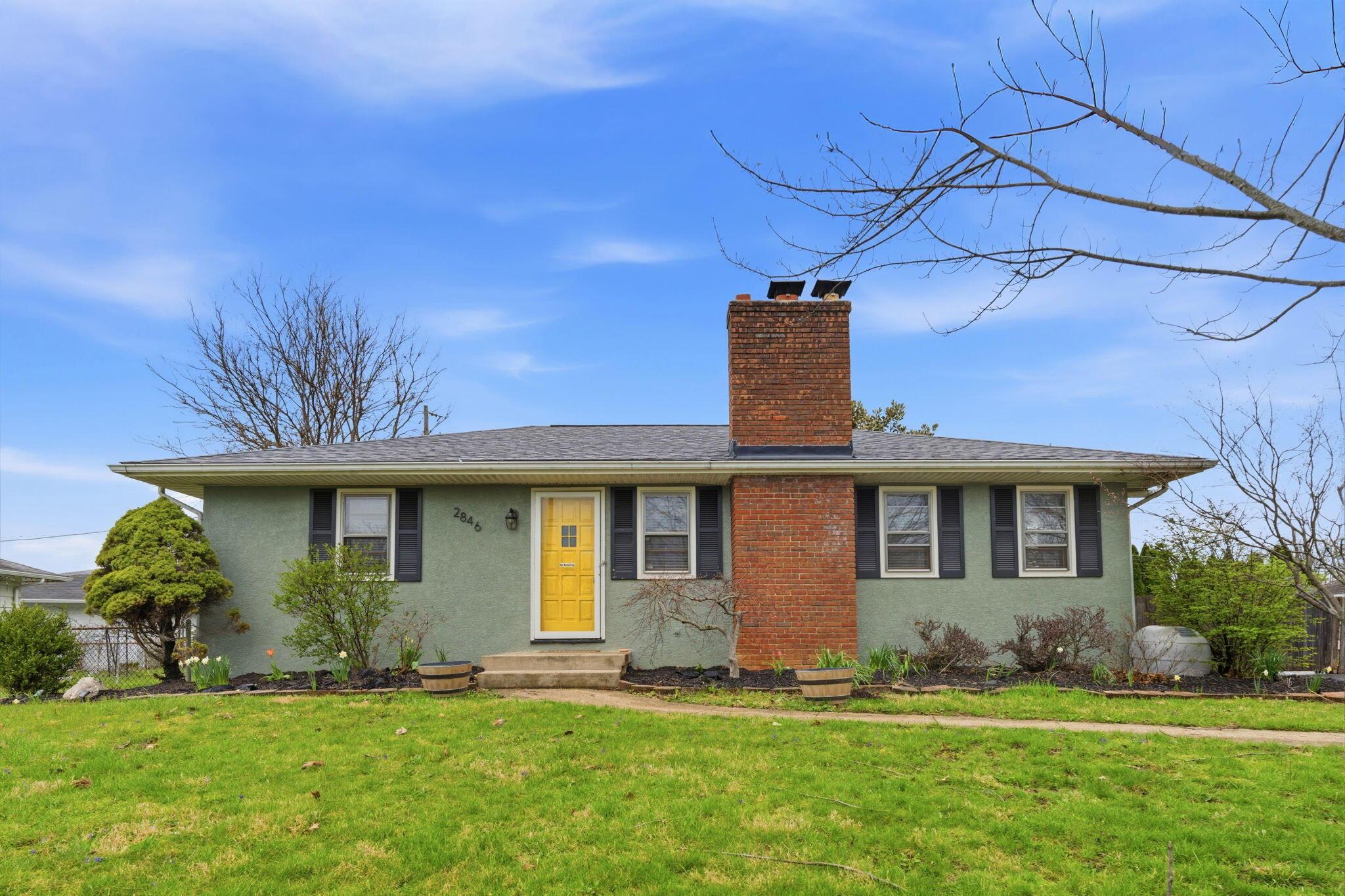 2846 Hampton Road South Columbus, OH 43232 - Photo 2 of 35 From the bold yellow front door to the timeless brick chimney centerpiece, this home delivers curb appeal with personality. Clean lines. Classic charm. And just enough edge to stand out in a sea of “same.”