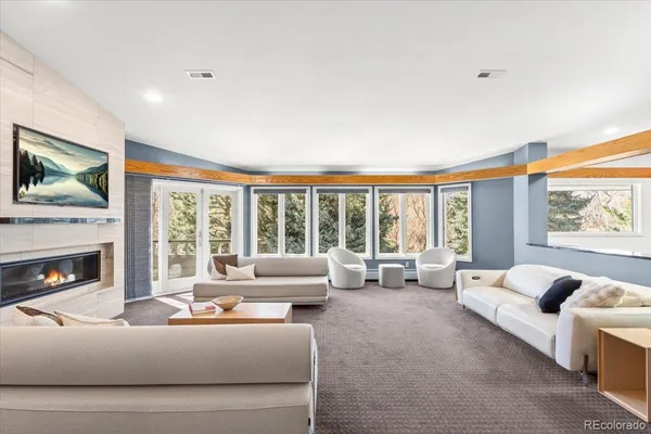 a living room with furniture and a large window