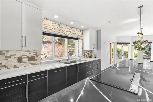 a kitchen with a sink stove and cabinets