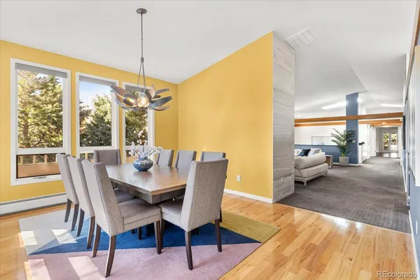 a view of a dining room with furniture window and wooden floor