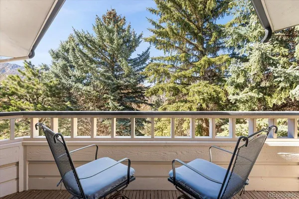 a view of balcony with furniture