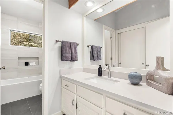 a bathroom with a sink and a bathtub