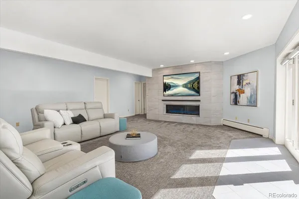 a living room with furniture and a rug