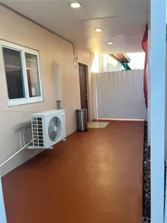 a view of an empty room with a fireplace