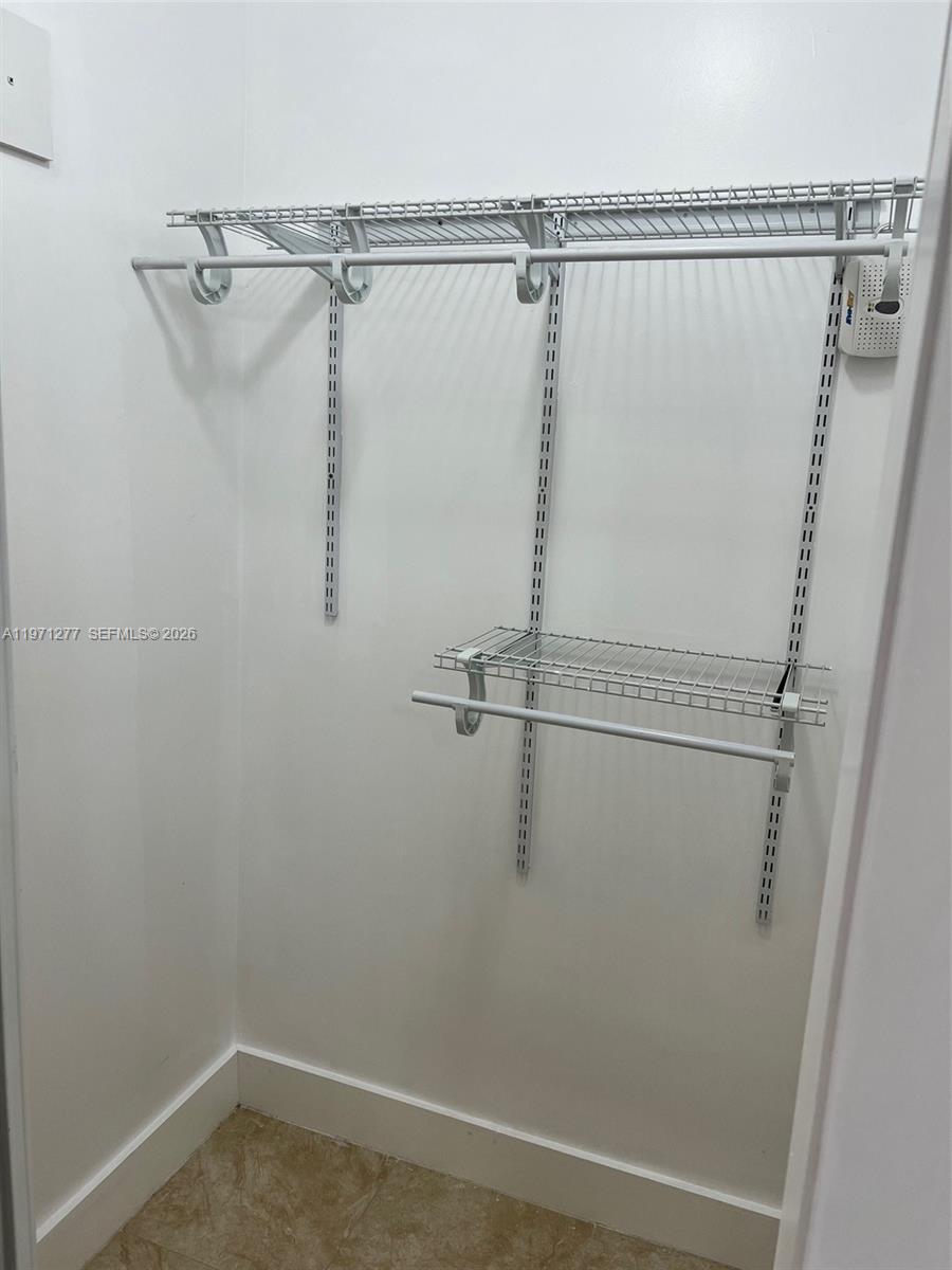4050 Southwest 5th Terrace, Unit 1 Miami, FL 33134 - Photo 4 of 12 a view of a room with racks on the wall