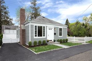 15 Ridgeland Terrace Rye, NY 10580 - Photo 1 of 1 a front view of a house with a yard and garage