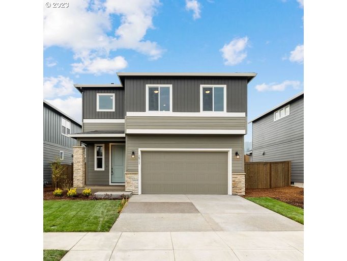 8521 North 5th Street, Unit LT 3 Ridgefield, WA 98642 - Photo 1 of 32 a front view of a house with a garden and garage