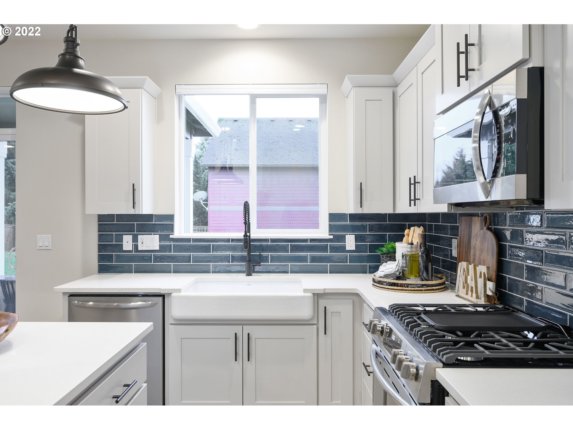 8521 North 5th Street, Unit LT 3 Ridgefield, WA 98642 - Photo 22 of 32 a kitchen with stainless steel appliances a sink stove and a window