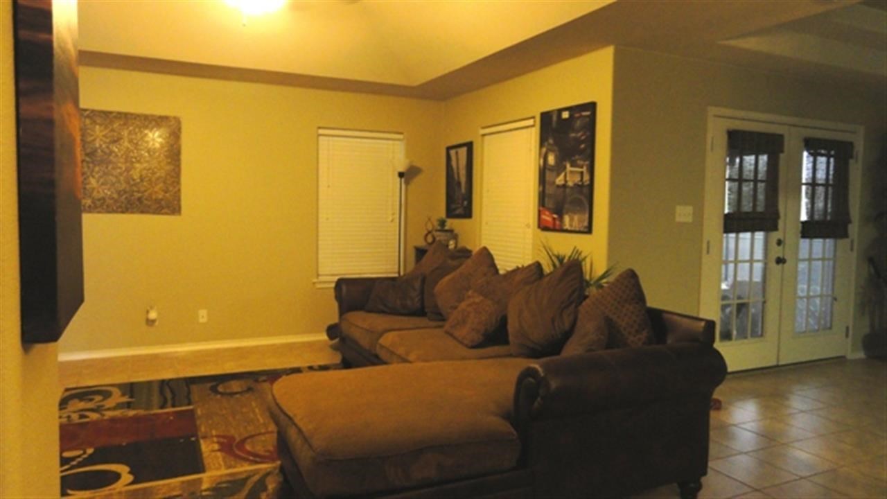102 Sun Ray Loop Laredo, TX 78041 - Photo 2 of 9 a living room with furniture and wooden floor