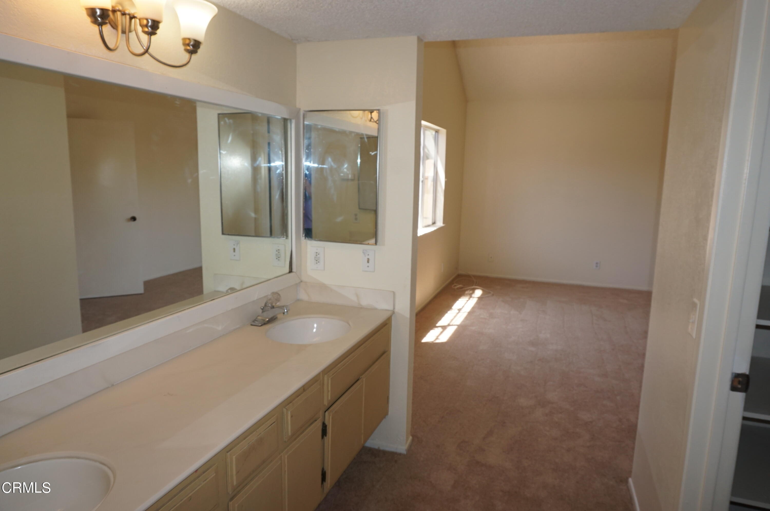 1500 Kipling Court Oxnard, CA 93033 - Photo 11 of 18 a bathroom with a sink and a mirror
