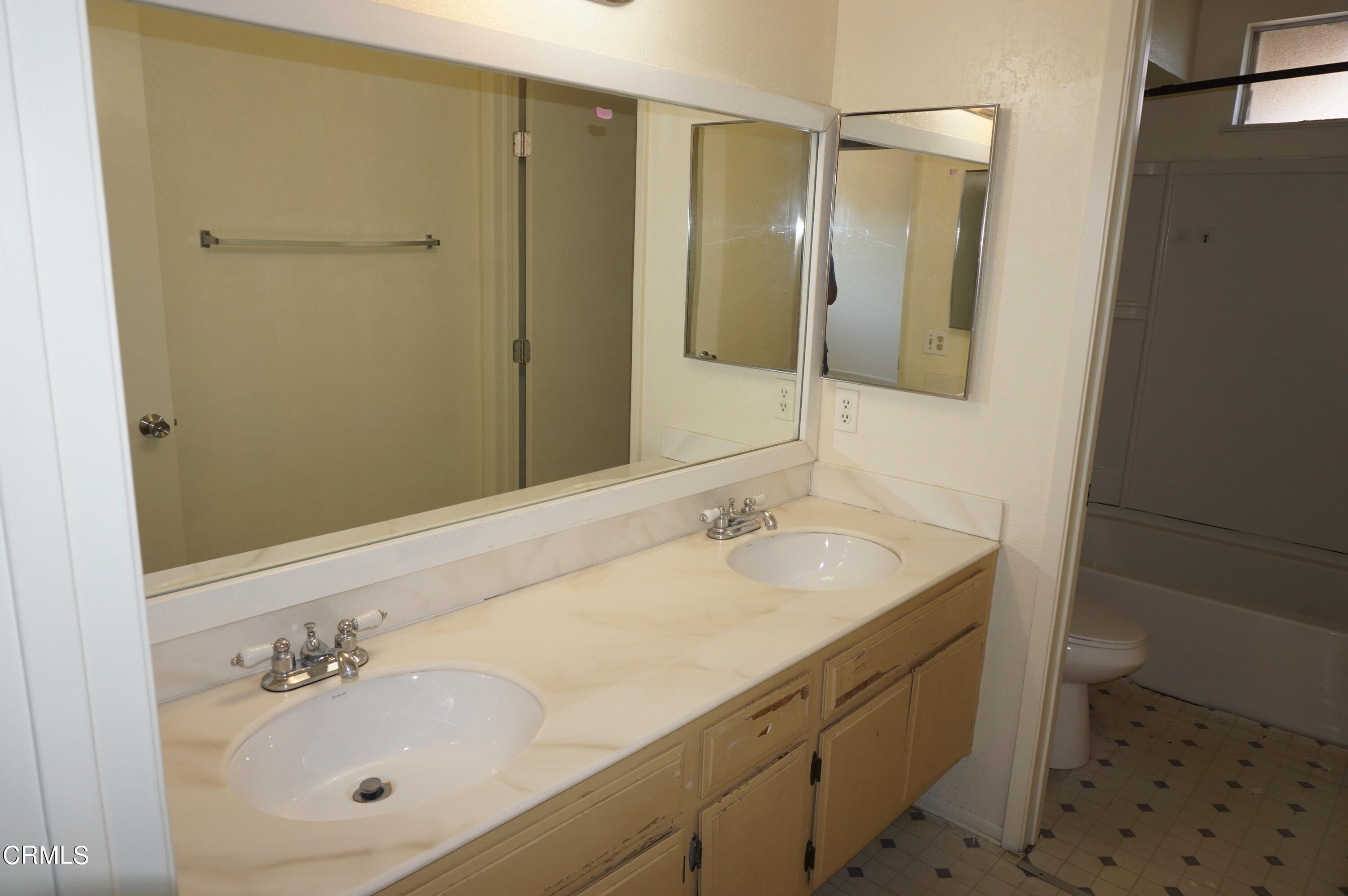 1500 Kipling Court Oxnard, CA 93033 - Photo 17 of 18 a bathroom with a sink and a mirror