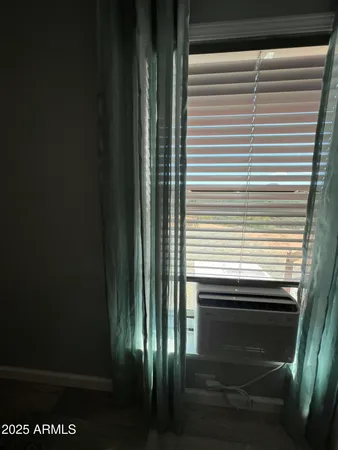 a view of a room that has a window