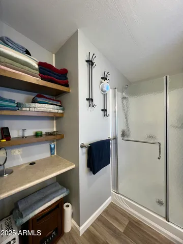 a bathroom with a bathtub and a shower