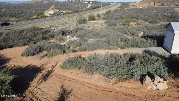 a view of a road with a yard